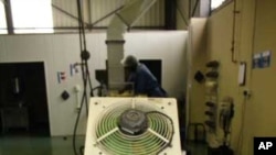 Raw corn chips roll off a machine at the biggest Mexican food factory in Midrand, near Johannesburg....The Mexican owner are 'big time" football fans