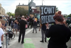 Demonstrators protest at the Third Precinct, May 27, 2020 as people protest the arrest and death of George Floyd who died in police custody Monday night in Minneapolis.