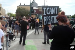 Demonstrators protest at the Third Precinct, May 27, 2020 as people protest the arrest and death of George Floyd who died in police custody Monday night in Minneapolis.