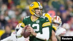 Green Bay Packers quarterback Aaron Rodgers looks to pass during the fourth quarter of a NFL game against the San Francisco 49ers at Lambeau Field in Wisconsin, Oct. 15, 2018.