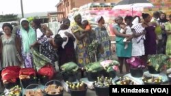 People line up to receive assistance in Mamfe, Cameroon, Dec. 20, 2018