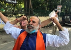 Jai Bhagwan Goyal, a leader of India's ruling Bharatiya Janata Party and an accused in the 1992 attack and demolition of a 16th century mosque, celebrates outside a court in Lucknow, India, Sept. 30, 2020.