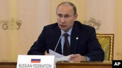 Russia's President Vladimir Putin speaks during a working session at a G-20 summit in St. Petersburg, Russia, Sept. 6, 2013.