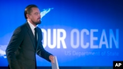 Actor Leonardo DiCaprio walks onstage to speak at the second day of the State Department's 'Our Ocean' conference at the State Department in Washington, Tuesday, June 17, 2014.