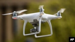 FILE - A drone hovers in Philadelphia, May 4, 2017.