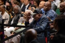 Survivors and siblings Viola Fletcher and Hughes Van Ellis listen as U.S. President Joe Biden delivers remarks on the centennial anniversary of the Tulsa race massacre during a visit to the Greenwood Cultural Center in Tulsa, Oklahoma, June 1, 2021.