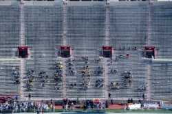 Michigan University fans watch during the first half of an NCAA college football game against Indiana at Memorial Stadium, Nov. 7, 2020, in Bloomington, Indiana.