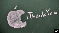 A message honoring Steve Jobs - Apple founder and former CEO - who died Wednesday, is scrawled on a blacked-out window at an Apple Store closed for the day in Seattle, October 6, 2011.