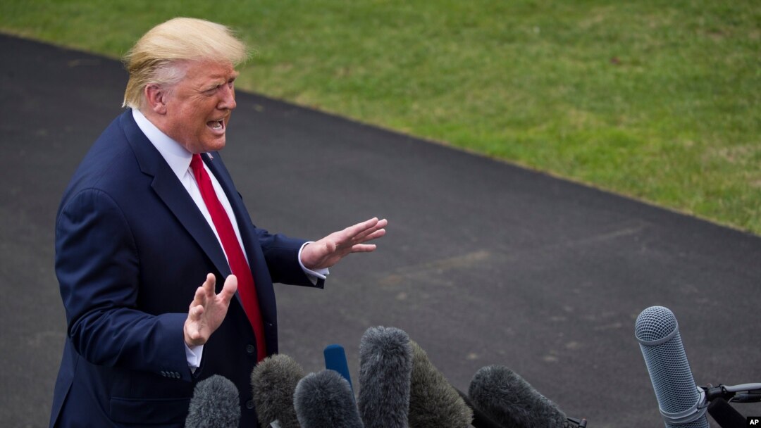 FILE - In this Sept. 9, 2019 file photo, President Donald Trump speaks with reporters before departing on Marine One from the South Lawn of the White House, in Washington.