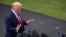 FILE - In this Sept. 9, 2019 file photo, President Donald Trump speaks with reporters before departing on Marine One from the South Lawn of the White House, in Washington.