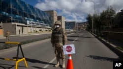 A soldier blocks an empty street during a government-ordered lockdown, in La Paz, Bolivia, March 23, 2020.