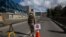 A soldier blocks an empty street during a government-ordered lockdown, in La Paz, Bolivia, March 23, 2020.
