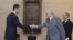 Syria's President Bashar al-Assad (L) shakes hands with U.N.-Arab League peace envoy for Syria Lakhdar Brahimi before a meeting in Damascus October 21, 2012.