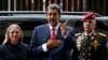 Venezuelan President Nicolas Maduro, accompanied by his wife Cilia Flores, arrives at the Supreme Court of Justice in Caracas, Venezuela, on Aug. 2, 2024.