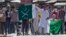 Kashmiri protesters hold Pakistani flags, one with swords and the word "jihad" written on it, during a protest in Srinagar, India, July 8, 2016. Youths in the Indian part of Kashmir protested allegations that Islamic preacher Zakir Naik was involved in making hate speeches.