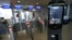 FILE - A U.S. Customs and Border Protection facial recognition device is ready to scan another passenger at a United Airlines gate.