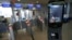 FILE - A U.S. Customs and Border Protection facial recognition device is ready to scan another passenger at a United Airlines gate.