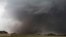 FILE - A tornado moves past homes in Moore, Oklahoma, May 20, 2013. Emergency officials in Oklahoma, Texas and Kansas are bracing for the start of what's historically the most active time of year for tornadoes while also facing wildfire threats because of severe drought conditions.