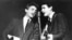 FILE - The Everly Brothers, Phil, left, and Don, perform on stage, July 31, 1964. 