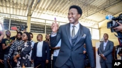 FILE - Independent candidate Venancio Mondlane holds up his finger after casting his vote in general elections in Maputo, Mozambique, Oct. 9, 2024.