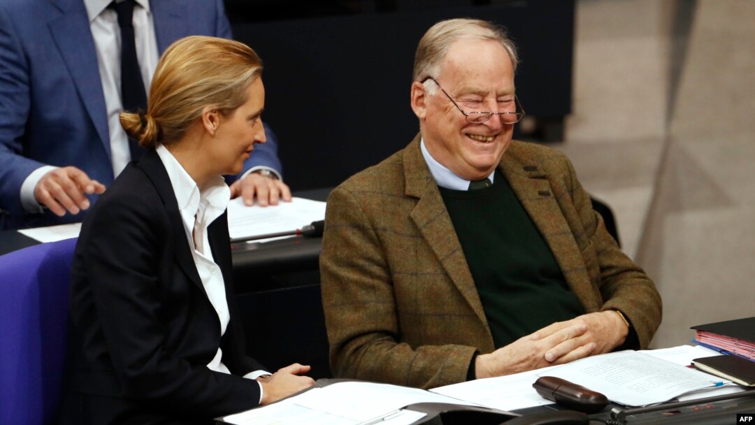 The co-leaders of the Alternative for Germany (AfD) far-right party, Alexander Gauland and Alice Weidel, laugh as they attend a session at the Bundestag lower house of Parliament in Berlin, Nov. 21, 2017. 