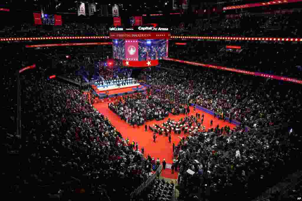 People gather inside Capital One Arena for an indoor Presidential Inauguration parade event in Washington, Jan. 20, 2025. 