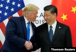 FILE - U.S. President Donald Trump meets with China's President Xi Jinping at the start of their bilateral meeting at the G-20 leaders summit in Osaka, Japan, June 29, 2019.