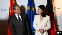 Chinese Foreign Minister Wang Yi and German Foreign Minister Annalena Baerbock meet at the Munich Security Conference in Munich, Germany, on Feb. 17, 2024.