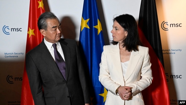 Chinese Foreign Minister Wang Yi and German Foreign Minister Annalena Baerbock meet at the Munich Security Conference in Munich, Germany, on Feb. 17, 2024.