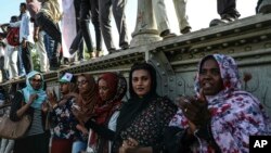 FILE - Sudanese women protesters are seen at a rally in Khartoum, April 23, 2019.