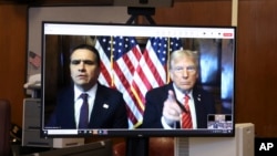 President-elect Donald Trump, right, appears remotely with attorney Todd Blanche for a sentencing hearing in the criminal case in which he was convicted on charges involving hush money, at New York Criminal Court in New York, Jan. 10, 2025.