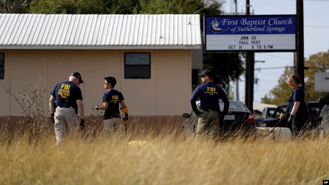 Law enforcement officials investigate the scene of a shooting at the First Baptist Church of Sutherland Springs, Nov. 6, 2017, in Sutherland Springs, Texas. 
