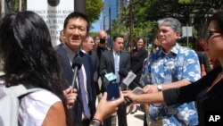 Hawaii Attorney General Douglas Chin speaks outside Federal Court house in Honolulu, March 29, 2017. Chin, the son of Chinese immigrants, argues that the Trump White House's travel ban, even its revised version, is discriminatory.