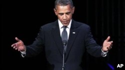 President Barack Obama pauses as he speaks at "A Concert for Hope" at the Kennedy Center in Washington, Sunday, Sept. 11, 2011, on the 10th anniversary of the Sept. 11 terrorist attacks.