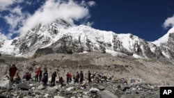 Trekkers rest at Mount Everest Base Camp, Nepal.