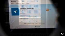The website of the Telegram messaging app is seen on a computer's screen in Moscow, Russia, Friday, April 13, 2018. A Russian court has ordered the blocking of a popular messaging app following a demand by authorities that it share encryption data with them. 