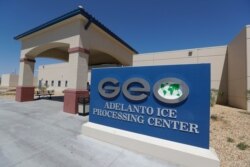 FILE - The Adelanto U.S. Immigration and Enforcement Processing Center operated by GEO Group, Inc., a Florida-based company specializing in privatized corrections, is seen in Adelanto, Calif., Aug. 28, 2019.