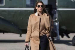 FILE - Hope Hicks, an adviser to U.S. President Donald Trump, walks to Air Force One to depart Washington with the president and other staff on campaign travel to Minnesota from Joint Base Andrews, Maryland, Sept. 30, 2020.