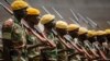 Members of the Zimbabwean military parade during a dress rehearsal for Friday's presidential inauguration of Emmerson Mnangagwa, at the National Sports Stadium in Harare, Zimbabwe, Nov. 23, 2017.