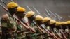 FILE: Members of the Zimbabwean military parade during a dress rehearsal for Friday's presidential inauguration of Emmerson Mnangagwa, at the National Sports Stadium in Harare, Zimbabwe, Nov. 23, 2017.