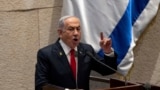 FILE - Israel's Prime Minister Benjamin Netanyahu addresses lawmakers in the Knesset, Israel's parliament, in Jerusalem, Nov.18, 2024.