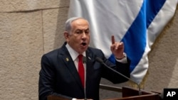 FILE - Israel's Prime Minister Benjamin Netanyahu addresses lawmakers in the Knesset, Israel's parliament, in Jerusalem, Nov.18, 2024.