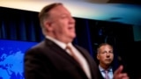 Secretary of State Mike Pompeo, accompanied by Assistant Secretary for the Bureau of Energy Resources Francis Fannon, right, speaks during a news conference at the State Department in Washington, Wednesday, July 15, 2020. (AP Photo/Andrew Harnik,…