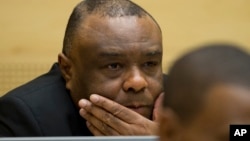FILE - Former Congo vice-president Jean-Pierre Bemba looks up at his trial at the International Criminal Court in The Hague, Netherlands, Sept. 29, 2015.
