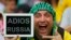 A spectator holds up a message for Russia before the start of the 2014 World Cup Group H soccer match against Belgium at Maracana stadium in Rio de Janeiro, Brazil.