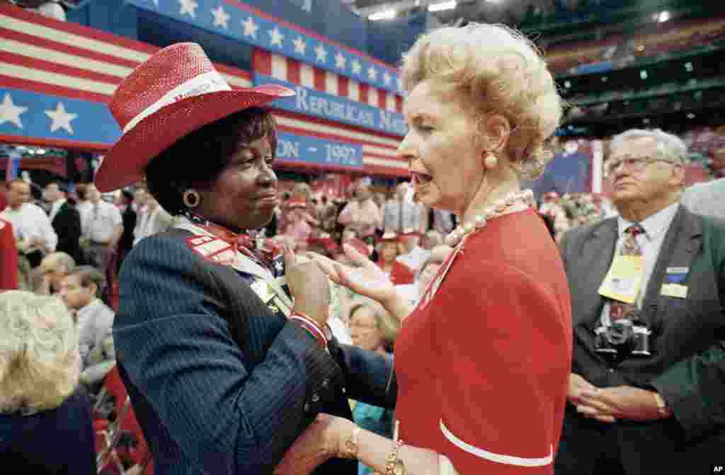 FILE - Anti-abortion leader Phyllis Schlafly, right, a delegate from Alton, Ill., talks with Juanita Crosby, a Missouri delegate from Kansas City, at the opening session of the Republican National Convention in Houston, Aug. 17, 1992. Abortion rights proponents gave up their fight to force a floor debate on softening the anti-abortion plank of the party.