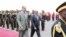Eritrea's President Isaias Afwerki, left, walks beside Somalia's President Mohamed Abdullahi Farmajo during a welcoming ceremony upon his arrival for a three-day visit to Eritrea, in Asmara, Eritrea, July 28, 2018.