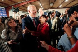 Democratic presidential candidate, former Vice President Joe Biden, greets supporters at a campaign event in Columbia, S.C., Feb. 11, 2020.