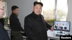 FILE - The United States says North Koreans' Internet access has been limited under Kim Jung Un, shown at a cartoon studio in an undated photograph released by North Korea's official news agency KCNA in November 2014.