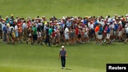 Jordan Spieth of the U.S. walks up the eighth fairway during second round play of the Masters golf tournament at the Augusta National Golf Course in Augusta, Georgia.